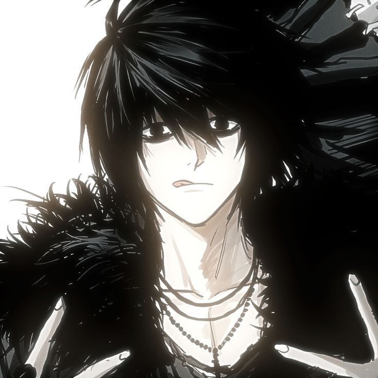 Young man with black hair, sharp eyes, and a serious expression, facing forward. He wears a dark outfit with a necklace and has dramatic, spiky hair. The scene is set against a soft gray background with bright light on his face, creating a tense, introspective mood. No readable text appears in the image.